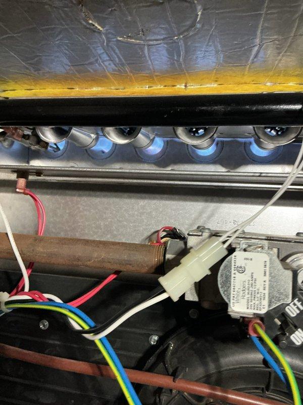 Responded to no heat call on 2017 Bryant furnace where blower was running but unit failed to produce heat following recent service. Diagnosed failed ignition system preventing burner assembly from lighting. Replaced faulty ignitor and verified proper flame sensor operation, restoring full heating function to unit.