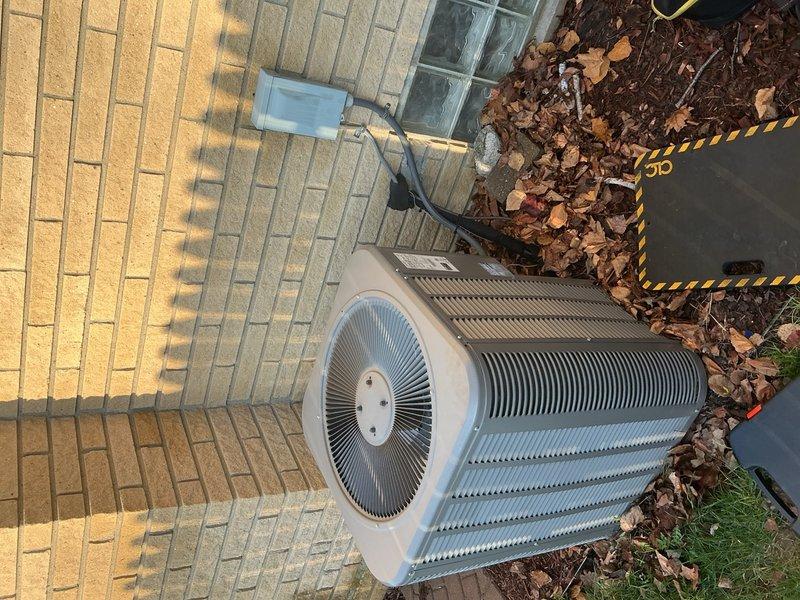 Responded to no-cooling complaint where outdoor condenser fan operated but no airflow from interior vents. Inspected outdoor unit and accessed indoor air handler through service panel. Diagnosed complete airflow restriction caused by severely clogged air filter preventing circulation through ductwork. Replaced dirty filter with new unit, restored proper airflow to all supply registers, and verified system cooling operation.