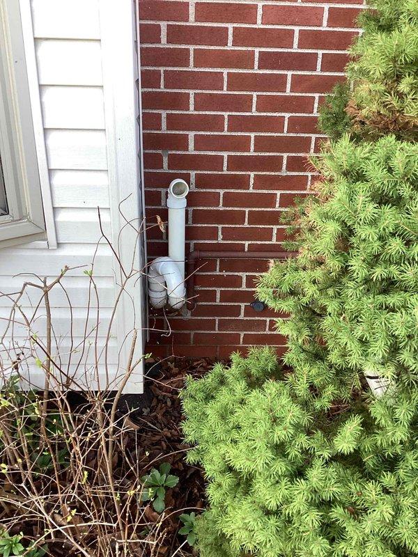 Responded to no-heat call where thermostat displayed error code on 14-year-old furnace located in basement. Diagnosed failed heat exchanger requiring full unit replacement. Provided comprehensive replacement estimate and documented exterior conditions including chimney requiring possible new liner and existing PVC vent termination through brick wall.