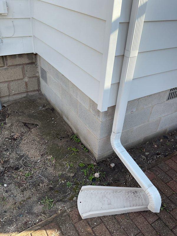 Completed diagnostic evaluation of multiple plumbing concerns throughout the residence. Assessed shower head assembly exhibiting excessive movement at wall connection point and experiencing delayed water discharge after use. Inspected bathroom sink drain stopper mechanism requiring reconnection to linkage assembly. Evaluated kitchen sink faucet with water spray issues and backflow concerns. Examined leaking valve in basement area. Provided comprehensive quote for relocation of existing hose bib currently positioned beneath crawl space and installation of additional hose bib on west side of structure to improve exterior water access from basement level.