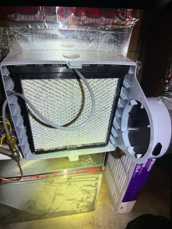 Completed comprehensive Gold AC inspection on single-unit residential system under 10 years old with air handler located in basement and condenser positioned in side yard between brick wall and vinyl siding. Performed full system evaluation including visual inspection of indoor air handler components, verified air filter condition and accessibility, inspected evaporator coil assembly, examined all ductwork connections and refrigerant lines, and assessed outdoor condenser unit for proper operation and clearance from debris. Additionally installed customer-provided thermostat as requested to complete the maintenance service, ensuring all components were functioning properly and system was operating within manufacturer specifications.