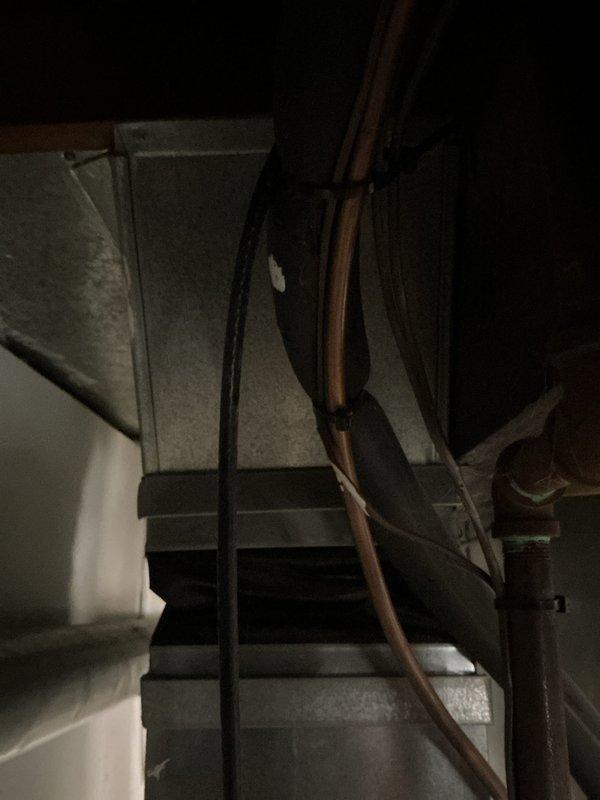 Provided estimate for complete furnace replacement following previous shutdown due to critical safety issues including seized inducer motor, failed blower motor with significant oil leakage, and cracked heat exchanger. The 10+ year old natural gas furnace located in basement was deemed non-operational and unsafe for continued use. Assessed existing ductwork configuration and utility connections to determine replacement specifications for new equipment installation.