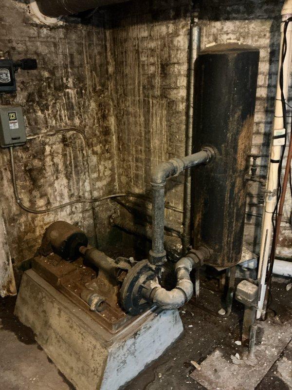 Responded to no heat call on 5-year-old Weil-McLain steam boiler located in basement mechanical room. Diagnosed failed spark ignition box and pilot assembly preventing unit from firing. Removed defective ignition components and installed new spark ignition box and pilot assembly at shop under purchase order, restoring proper ignition sequence and heat operation to building.