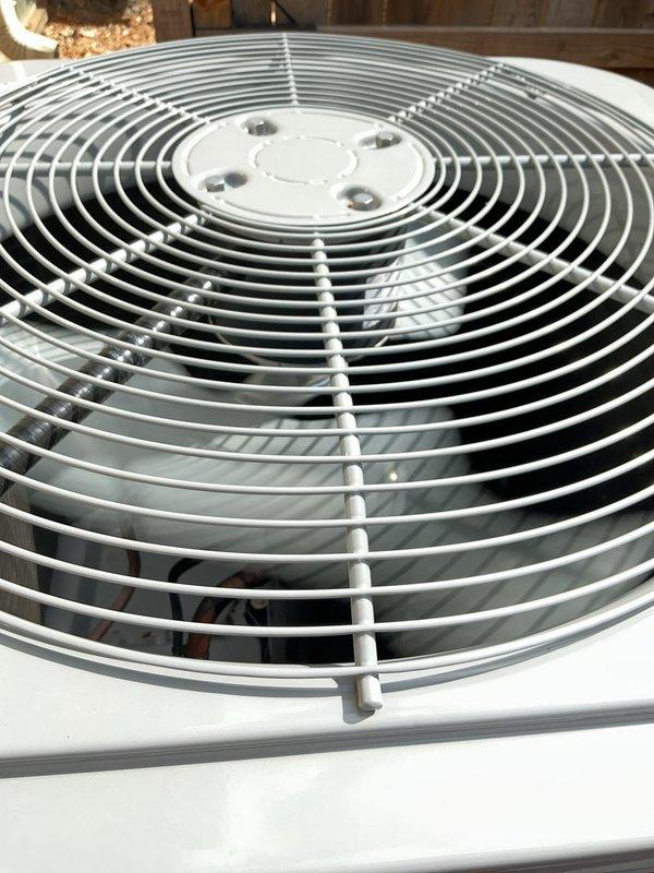 Completed comprehensive Gold-level inspection on residential HVAC system consisting of 10+ year old furnace and air conditioning unit. Performed thorough multi-point evaluation of furnace located in basement, inspecting burner assembly, heat exchanger, gas valve operation, blower motor assembly, and all electrical connections. Examined outdoor condensing unit, verifying fan motor operation, condenser coil condition, and proper airflow through top-mounted fan guard. Confirmed both heating and cooling systems operational at time of inspection. Documented equipment condition through photographic records showing internal furnace components including burner assembly, flame sensor, ignition system, and blower motor, as well as exterior condenser unit with protective fan grille. Verified area surrounding outdoor unit maintained clear of debris for optimal performance.