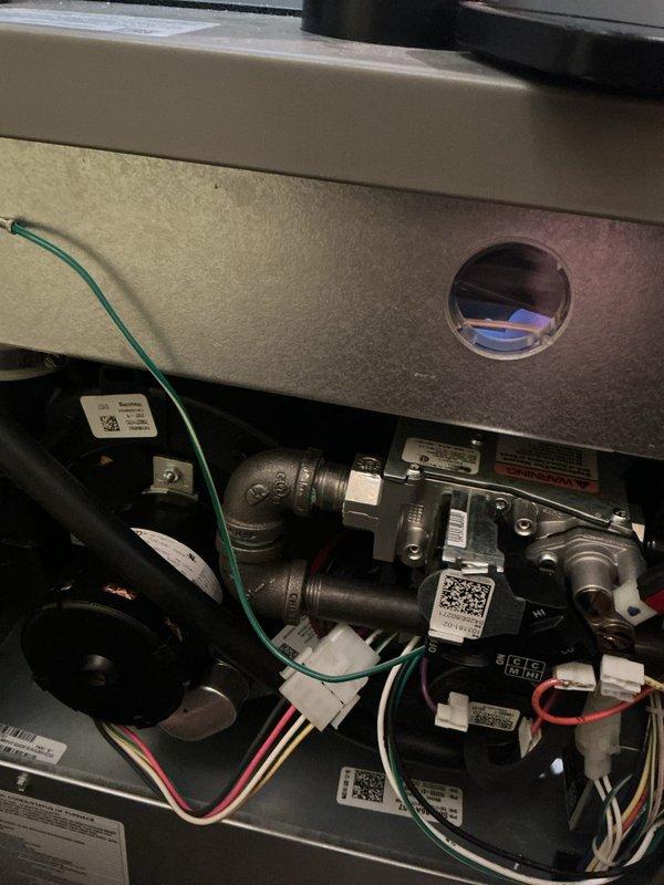 Completed scheduled preventive maintenance on residential HVAC system including furnace, air conditioning unit, and water heater per gold plan agreement. Accessed furnace unit in basement and performed comprehensive inspection of gas valve assembly, electrical connections, and internal components. Verified proper operation of all safety controls, inspected wiring harnesses and connectors, and confirmed equipment labeling and identification tags were intact. Proceeded to exterior air conditioning condenser unit located at rear of property and performed AC tune-up service. Inspected condenser coil, fan motor assembly, and top grille components. Evaluated overall unit condition noting normal weathering consistent with one year of operation. All equipment operating within manufacturer specifications with no deficiencies noted requiring immediate attention. System ready for continued service.