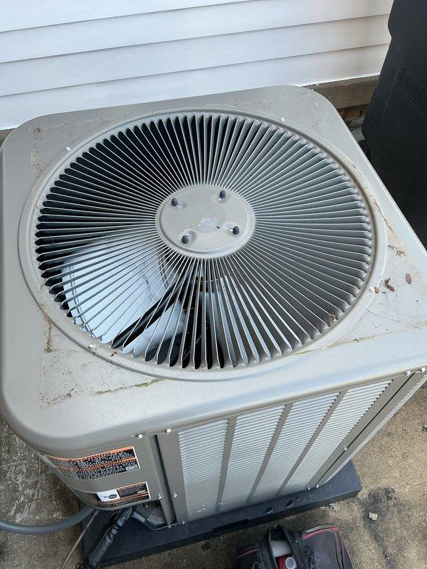 Completed scheduled preventive maintenance on residential HVAC system including furnace, air conditioning unit, and water heater per gold plan agreement. Accessed furnace unit in basement and performed comprehensive inspection of gas valve assembly, electrical connections, and internal components. Verified proper operation of all safety controls, inspected wiring harnesses and connectors, and confirmed equipment labeling and identification tags were intact. Proceeded to exterior air conditioning condenser unit located at rear of property and performed AC tune-up service. Inspected condenser coil, fan motor assembly, and top grille components. Evaluated overall unit condition noting normal weathering consistent with one year of operation. All equipment operating within manufacturer specifications with no deficiencies noted requiring immediate attention. System ready for continued service.