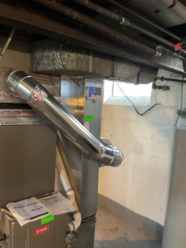 Installed Aprilaire 500A whole-home humidifier on existing Bryant HVAC system in basement mechanical room. Unit was mounted to supply ductwork with proper saddle valve connection to domestic water supply line and drainage tube routed to floor drain. System was tested and verified operational to improve indoor air quality during heating season.