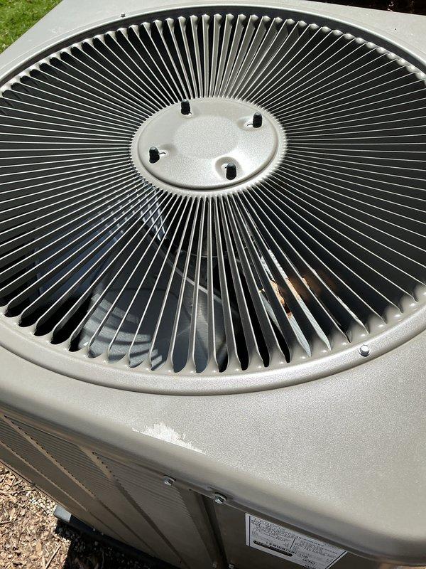 Completed comprehensive Gold AC inspection on a 1-year-old residential air conditioning system with air handler located in basement. Performed thorough visual inspection of indoor air handler components including blower motor assembly, electrical connections, wire harnesses, control modules, and refrigerant lines. Inspected outdoor condensing unit including fan assembly with radial blade configuration, verified proper operation of all mechanical components, and confirmed unit exterior condition. System found to be operating properly with all components functioning as designed and no service issues identified.