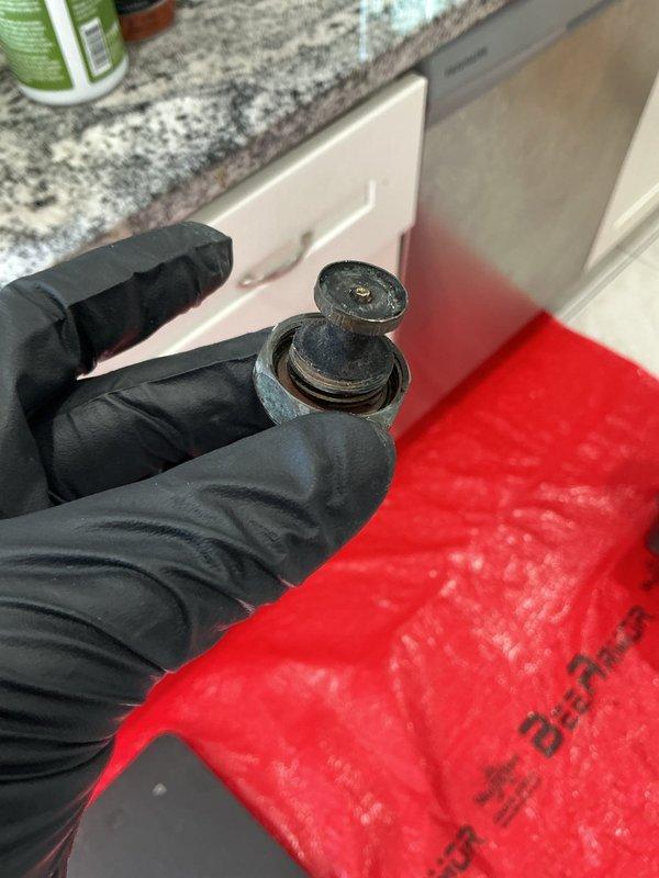 Responded to service call for meter valve and hose bib inspection. Upon arrival, accessed mechanical compartment housing compressor system with copper piping network and identified worn valve components requiring attention. Removed and inspected defective valve assembly, which showed significant wear and age-related deterioration. Replaced faulty valve component to restore proper function and prevent potential water leakage. Tested system operation to verify repair integrity and proper valve operation. All components functioning correctly upon completion.