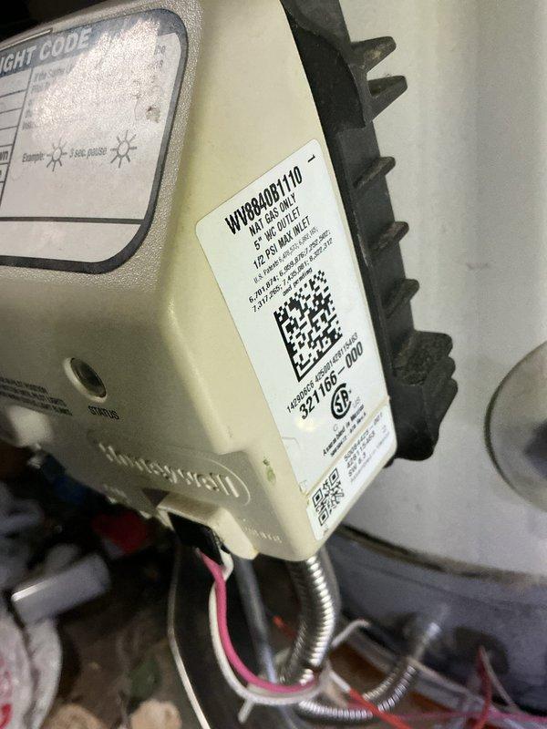 Responded to no water complaint at residential property. Upon inspection, found aging gas-fired water heater on main floor, estimated to be approximately 10 years old. Observed significant corrosion on copper supply piping with deteriorated foam insulation, extensive rust staining in drain pan, and visible wear on burner assembly components. Assessed gas control valve, burner assembly, and thermocouple connections. Documented condition of unit including corroded plumbing connections, compromised drain pan integrity, and overall deterioration consistent with extended service life. Provided customer with findings and recommendations regarding water heater replacement due to age and observed corrosion issues that could lead to system failure.
