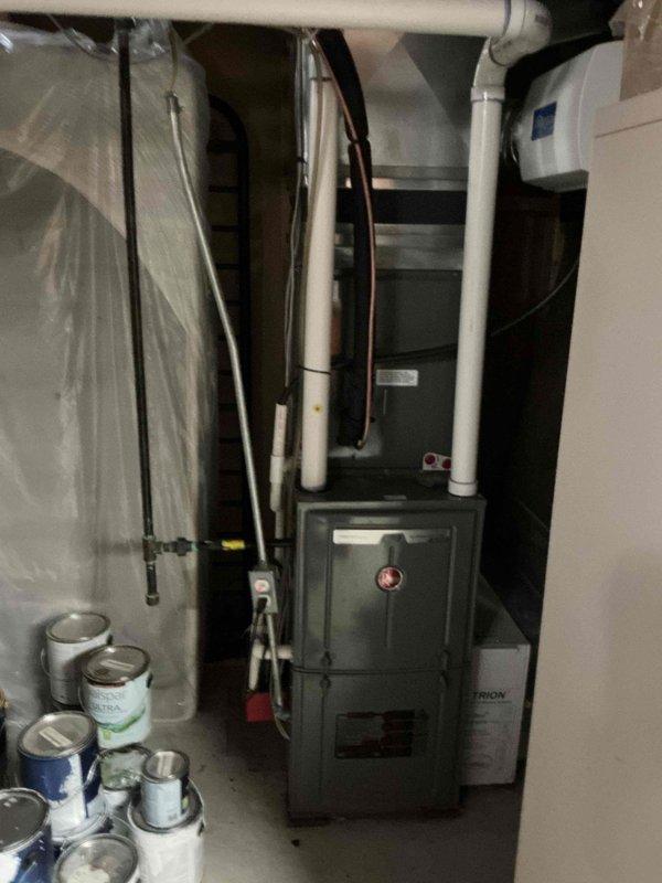 Completed comprehensive Gold-level furnace inspection on 10-year-old forced air heating system located in basement mechanical room. Performed thorough visual and operational assessment of furnace components including gas valve, ignition control module, heat exchanger, blower assembly, and all electrical connections. Inspected PVC venting system, refrigerant lines, and associated HVAC equipment. Verified proper furnace operation, checked all safety controls, examined wiring harnesses and control board functionality, and documented system condition with photographic records. All components found operating within normal parameters with no immediate repairs required.