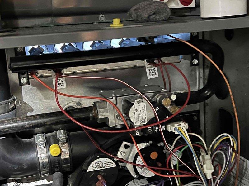 Completed comprehensive Gold-level furnace inspection on 10-year-old forced air heating system located in basement mechanical room. Performed thorough visual and operational assessment of furnace components including gas valve, ignition control module, heat exchanger, blower assembly, and all electrical connections. Inspected PVC venting system, refrigerant lines, and associated HVAC equipment. Verified proper furnace operation, checked all safety controls, examined wiring harnesses and control board functionality, and documented system condition with photographic records. All components found operating within normal parameters with no immediate repairs required.