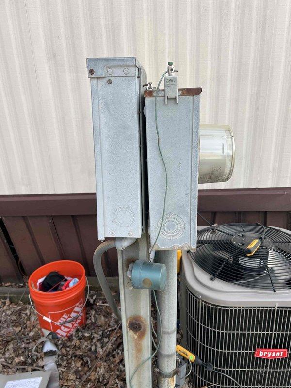 Completed comprehensive tune-up and inspection on Bryant brand air conditioning system over 10 years old at mobile home residence. Outdoor condensing unit examined with focus on compressor operation, refrigerant levels, electrical connections, and condenser coil cleanliness. Verified proper function of condensate pump assembly mounted on exterior wall, checked drain line flow and pump operation. Indoor evaporator coil accessed in utility closet, inspected coil condition, refrigerant line connections including compression fittings and O-ring seals, and verified drain pan integrity. All components found operational, system running within normal parameters at time of inspection.