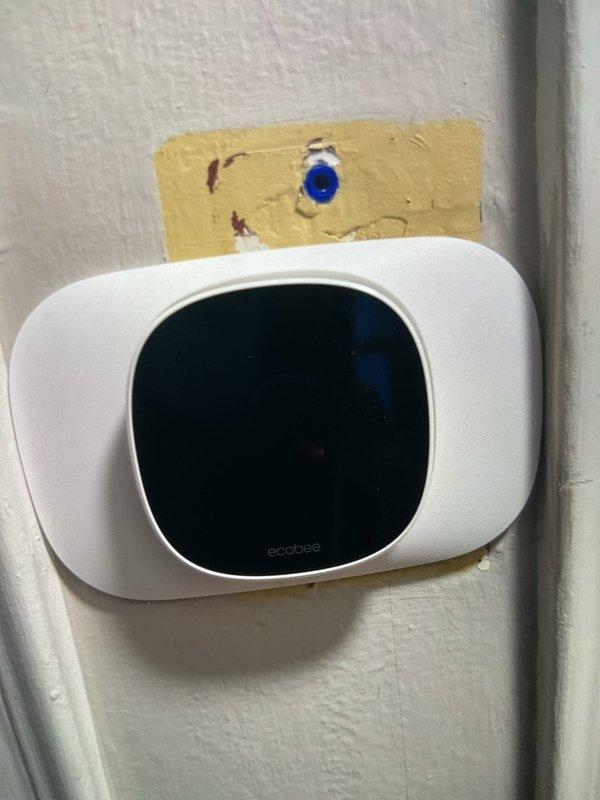 Responded to service call for furnace causing air conditioning system to run simultaneously. Diagnosed thermostat wiring issue with Ecobee smart thermostat located on main level controlling basement furnace equipment. Corrected improper wire configuration at thermostat that was sending call signal to both heating and cooling systems, verified proper system operation, and confirmed furnace and AC now cycle independently per thermostat programming.