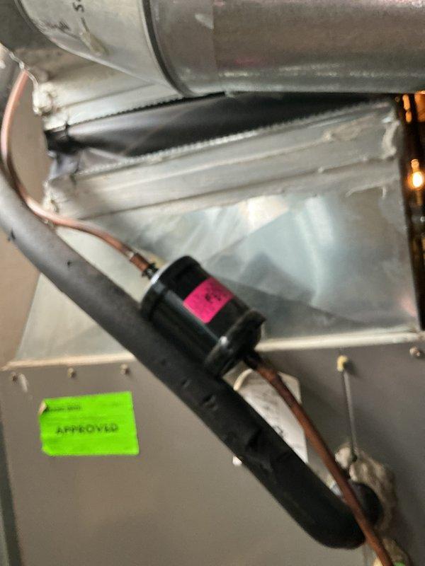 Completed HVAC system replacement estimate for central air conditioning unit with chronic refrigerant loss over multiple years. System assessment revealed non-functional cooling with airflow issues despite fan operation. Evaluated existing equipment including interior components, capacitor, refrigerant lines, and thermostat displaying current temperature readings, documenting condition for replacement recommendation and equipment buyback consideration.