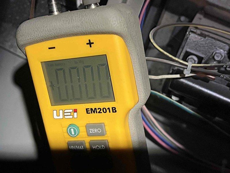 Responded to service call for furnace pilot issue on unit located in basement, less than 10 years old. Performed diagnostic testing using digital multimeter to measure voltage and electrical parameters at control board and gas valve assembly. Verified proper voltage readings of 122.8V and microamp readings of 00.45 on flame sensor circuit. Inspected pilot assembly, flame sensor, and ignition system components to ensure proper operation and safe functionality of heating system.