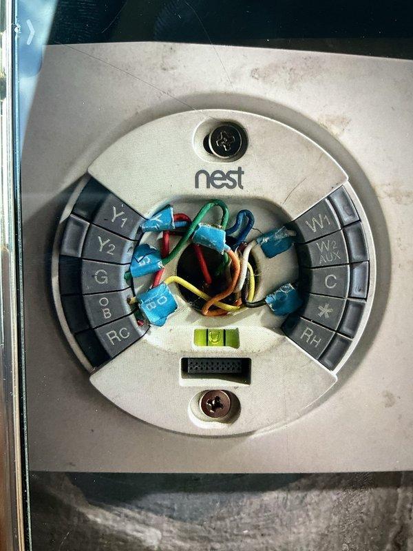 Responded to no-heat call on 5-year-old furnace in basement that failed to restart after being shut down for seasonal weather. Diagnosed issue using Nest thermostat wiring inspection and pressure testing equipment, which revealed improper thermostat configuration and confirmed system pressures at 195 PSI with -1.13 differential reading. Verified all thermostat terminal connections (Y1, Y2, G, OB, RC, W1, W2, AUX, C, RH), corrected wiring issues, and successfully restored furnace operation with all systems functioning within normal parameters.