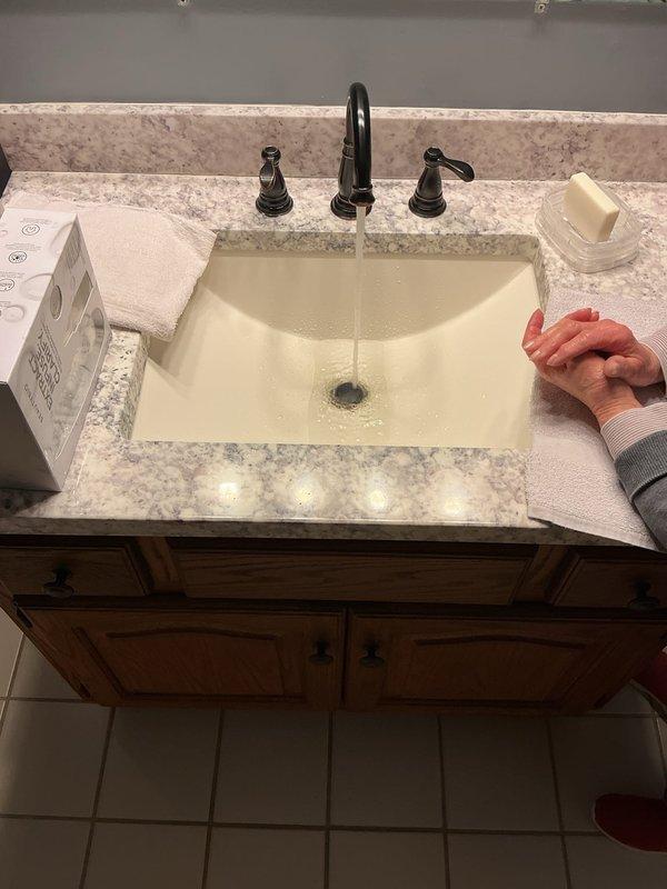 Responded to service call for non-functional garbage disposal and slow-draining bathroom sink. Inspected three-quarter horsepower InSinkErator unit that had been inoperative for several months. Evaluated electrical connections, reset mechanism, and internal components of disposal unit. Assessed drainage system and P-trap configuration beneath kitchen sink. Addressed bathroom vanity sink experiencing recent drainage issues by clearing obstruction and testing water flow to restore proper drainage function. Verified all plumbing connections, flexible hoses, and PVC pipe assemblies were secure and functioning correctly upon completion.