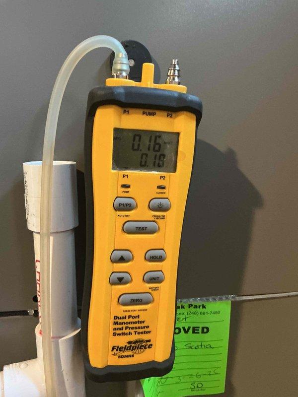 Responded to service call for banging sounds in vents and rattling noise from recently installed furnace. Performed diagnostic testing using dual port manometer to measure static pressure readings throughout the system, recording measurements at supply and return plenums. Readings indicated potential airflow imbalance with supply pressure at 0.32" and return at -0.30". Inspected internal furnace components including blower motor assembly, wiring connections, and condensate drainage system. Verified all electrical connections were secure and properly terminated. Checked blower motor mounting and housing for loose hardware that could cause rattling. Examined ductwork connections at plenum for proper sealing and secure fastening to eliminate banging sounds. System remained operational throughout diagnostic process with heating capability confirmed.