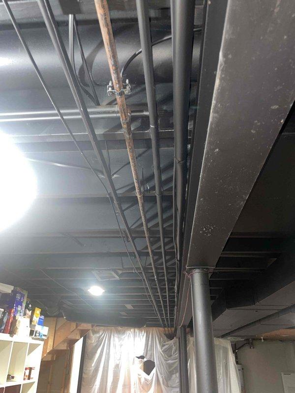 Provided comprehensive estimate for replacement of 20+ year old air conditioning unit currently located outside the residence. Assessed existing system configuration including natural gas furnace integration, evaluated basement mechanical room infrastructure with exposed ductwork and copper piping, and documented current equipment placement and accessibility for future AC replacement installation.