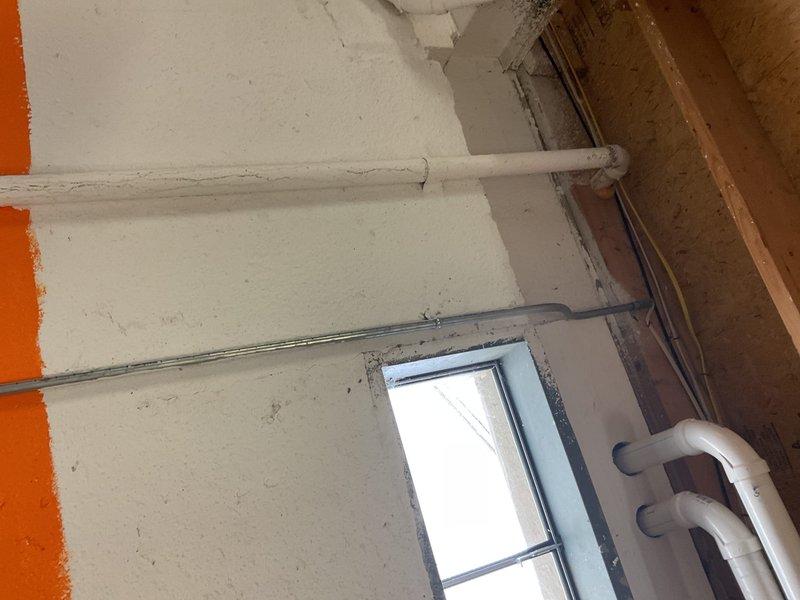 Responded to emergency call for sump pump failure that resulted in basement flooding over the weekend. Upon arrival, assessed the utility area and identified failed sump pump system as the source of water intrusion. Removed and replaced malfunctioning sump pump unit with new reliable model, ensuring proper discharge line configuration and check valve installation to prevent backflow. Tested system operation through multiple cycles to verify proper float switch function and adequate pumping capacity.

Conducted comprehensive whole-home plumbing inspection as requested. Examined all accessible water supply lines, shut-off valves, and drain systems throughout the property. Inspected basement plumbing infrastructure including exposed PVC piping and supply line connections. Identified water staining and discoloration around valve connection points in utility cabinet, indicating previous minor leaks or moisture accumulation. Evaluated condition of braided stainless steel flexible supply line