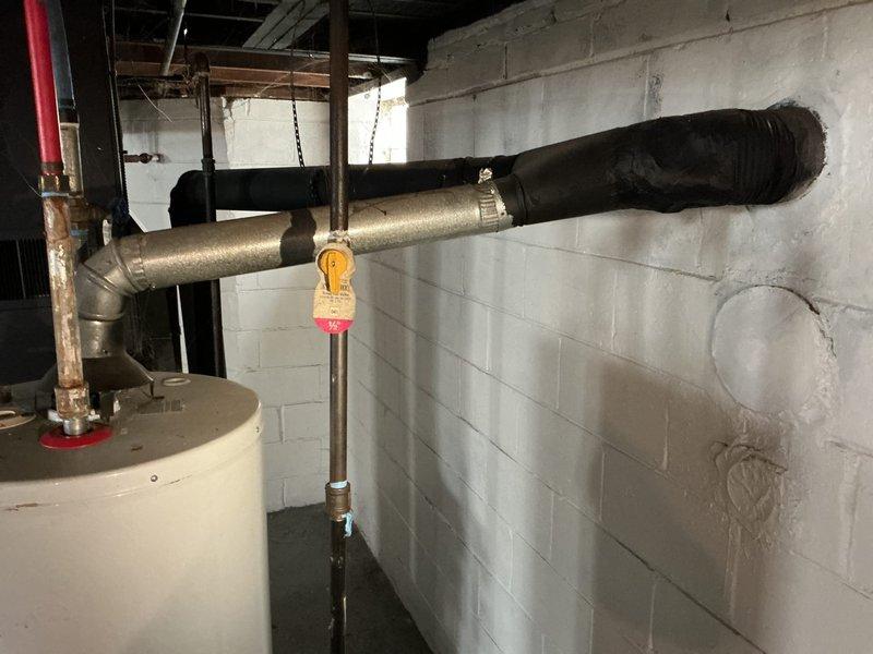 Responded to no hot water complaint at residential property with 7-8 year old tanked water heater located in basement. Upon inspection, identified failed gas control valve preventing burner operation. Replaced defective gas control valve, purged air from gas line, and verified proper ignition sequence. Tested hot water delivery throughout home and confirmed full restoration of domestic hot water supply to all fixtures.