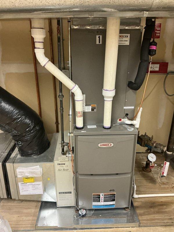 Completed spring maintenance on eight commercial HVAC units located in attic space during standard business hours. Performed comprehensive preventive maintenance inspections on all systems, including Lennox furnace units and air handler equipment with Trion Air Bear filtration systems. Documented equipment conditions with photography, verified proper operation of all mechanical components, checked refrigerant levels, inspected condensate drain lines and PVC venting systems, and confirmed all units were functioning within manufacturer specifications.