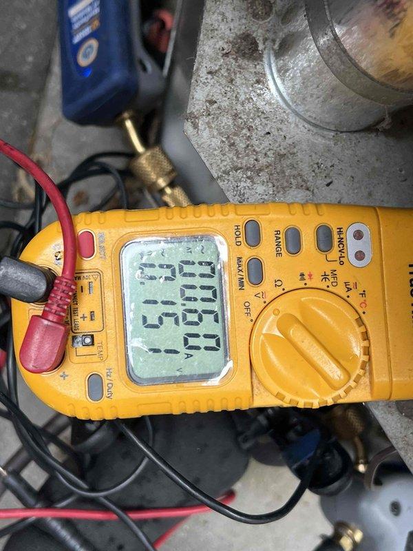Performed comprehensive pre-season cooling maintenance on a 10-year-old air conditioning system. Conducted complete AC tune-up including electrical diagnostics using digital multimeter to verify proper voltage and amperage readings at the outdoor condensing unit. Inspected condenser fan motor and fan blade assembly, confirming secure mounting hardware and proper mechanical operation. Evaluated fan guard integrity and verified unobstructed airflow through the unit. System tested and confirmed operational with all components functioning within normal parameters.
