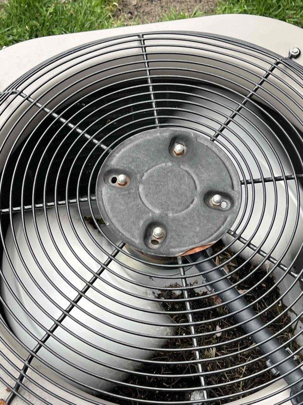 Performed comprehensive pre-season cooling maintenance on a 10-year-old air conditioning system. Conducted complete AC tune-up including electrical diagnostics using digital multimeter to verify proper voltage and amperage readings at the outdoor condensing unit. Inspected condenser fan motor and fan blade assembly, confirming secure mounting hardware and proper mechanical operation. Evaluated fan guard integrity and verified unobstructed airflow through the unit. System tested and confirmed operational with all components functioning within normal parameters.