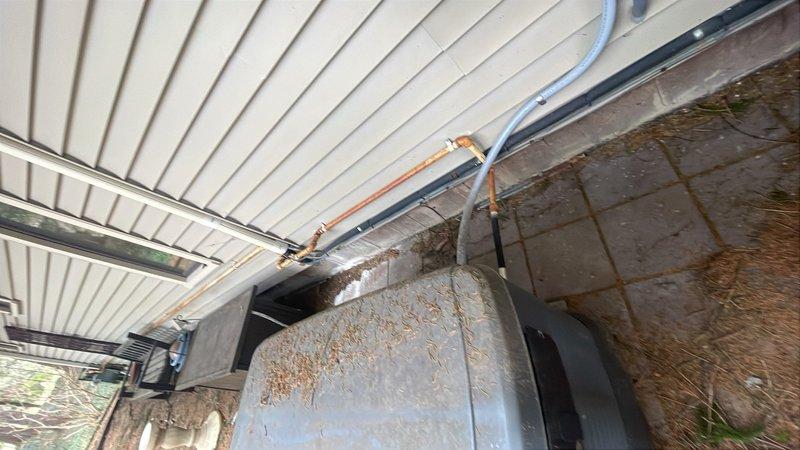 Completed installation of 2.5 ton Unico air conditioning system including new condenser unit and evaporator coil at rear of residence. Performed system flush, installed wet switch, and reconnected all electrical connections including contactor wiring at exterior disconnect box. Mechanical and AC permit requested for installation work.