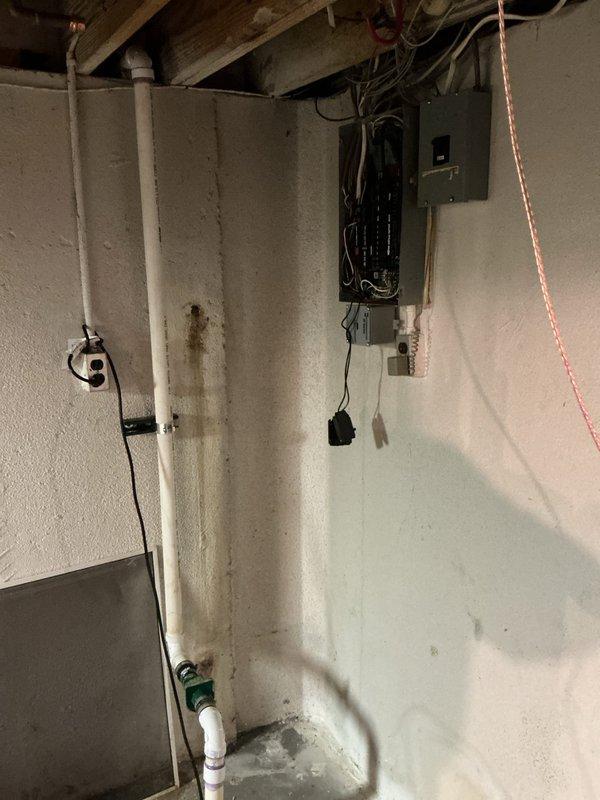 Completed installation of 18kW standby generator system including all mechanical, electrical, and gas piping components. Installed automatic transfer switch in basement utility area with proper circuit breaker integration to existing electrical panel. Ran black gas piping along exterior brick wall from natural gas meter to generator location, performed pressure testing to verify system integrity, and coordinated permit requirements for the complete installation.