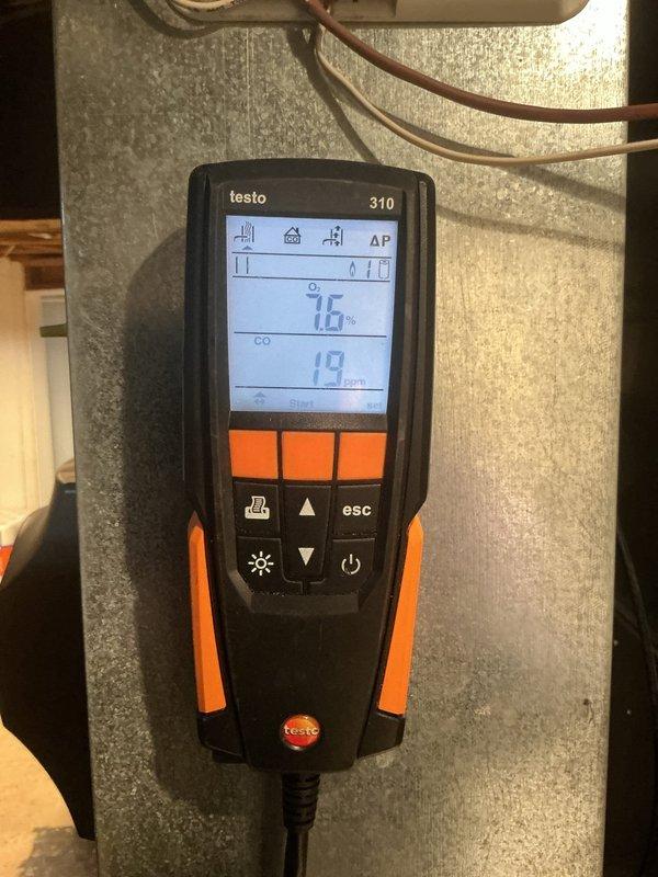 Completed routine furnace maintenance and city-required inspection on basement-located gas furnace. Performed combustion analysis using Testo 310 analyzer, recording oxygen levels at 16% and carbon monoxide at 19 ppm, confirming safe operational parameters. Inspected burner assembly, gas valve connections, electrical wiring, and all critical components; system found operating within normal specifications and passed inspection requirements.