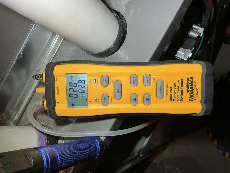 Responded to service call for loud banging noise coming from furnace air duct during system startup on unit previously installed in December. Performed diagnostic testing using digital manometer to measure static pressures and airflow characteristics throughout the duct system. Reviewed manufacturer specifications and switch configuration tables to verify proper blower speed settings and operational parameters. Measurements indicated pressure imbalances consistent with duct expansion/contraction noise during heating cycle initiation, a common occurrence in new installations as materials settle and adjust to temperature cycling.