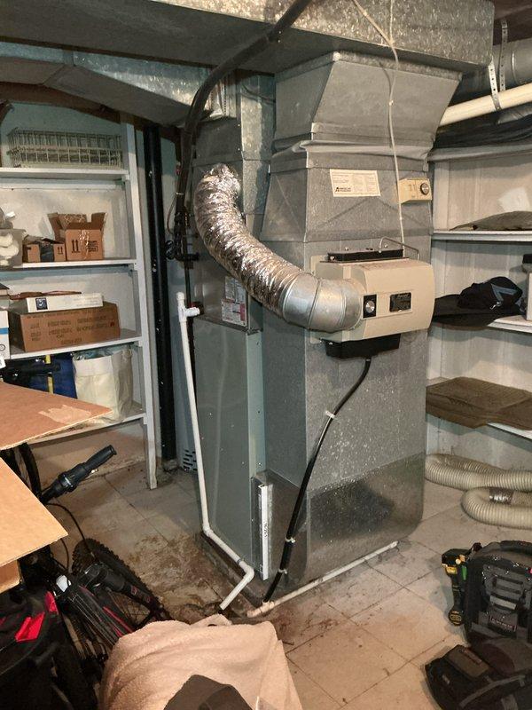 Completed preventive maintenance tune-up on 2-year-old HVAC system located in basement utility area. Performed comprehensive system inspection of air handler unit, verified proper operation of all components, checked ductwork connections, and confirmed system is functioning within manufacturer specifications.