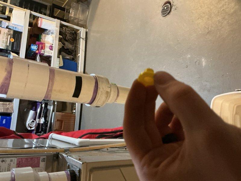 Responded to callback for water dripping from furnace following recent maintenance visit. Upon inspection, identified active condensate leak from furnace drain line and associated PVC piping connections in basement. Condensate drain pan was positioned beneath leak to collect water. Inspected all drain line connections, fittings, and trap assembly for proper sealing and alignment. Addressed leak source by resealing affected connection points and verified proper pitch on condensate drain line to ensure adequate drainage. Tested system operation to confirm condensate was flowing correctly through drain system without further leakage. Verified furnace operation and monitored for several cycles to ensure issue was fully resolved.