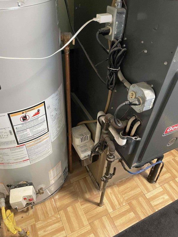 Conducted comprehensive assessment of existing HVAC system and water heater for replacement quote. Evaluated current furnace, air conditioning unit, and water heater installation, documenting equipment specifications, configurations, and spatial requirements. Photographed thermostat, heating and cooling equipment, and water heater to provide accurate replacement recommendations for complete system upgrade.