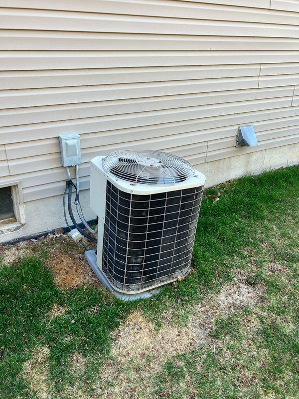 Conducted full system estimate for replacement of 24-year-old original equipment including furnace and air conditioning system. Evaluated existing outdoor condenser unit installed on concrete pad with standard refrigerant line configuration and electrical disconnect. Documented current system specifications and provided comprehensive replacement quote for complete HVAC system upgrade.