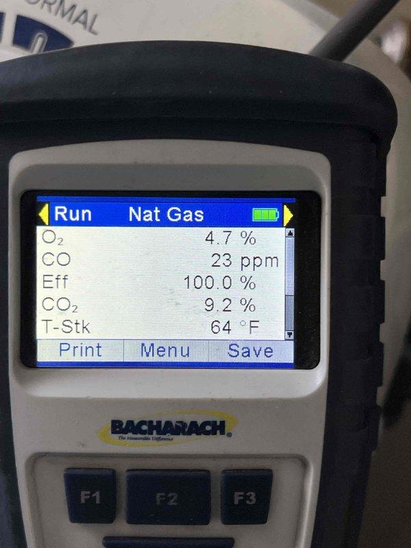 Performed seasonal tune-up and combustion analysis on 1-year-old natural gas furnace located in utility room. Combustion testing revealed optimal performance with oxygen levels at 4.7%, carbon monoxide at 23 ppm, carbon dioxide at 9.2%, and combustion efficiency at 100.0% with stack temperature of 64°F. All equipment operating within manufacturer specifications with no deficiencies noted.