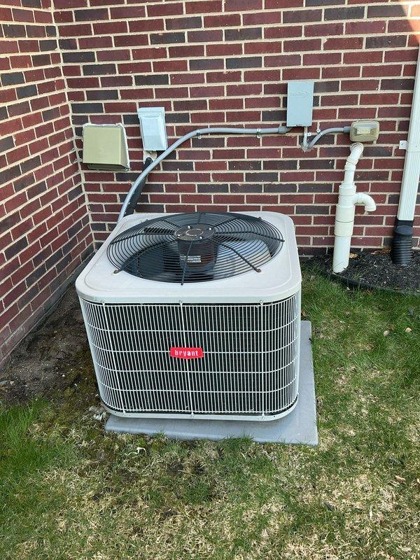 Completed comprehensive Gold AC Inspection on residential split system with outdoor condenser unit and basement air handler. Performed thorough evaluation of system components including Nest thermostat functionality set at 69 degrees, outdoor condenser unit with visible fan operation and intact grille fins, electrical connections at wall-mounted junction boxes, and associated conduit and drainage lines. All accessible components inspected per Gold maintenance protocol standards with system operating within normal parameters at time of inspection.