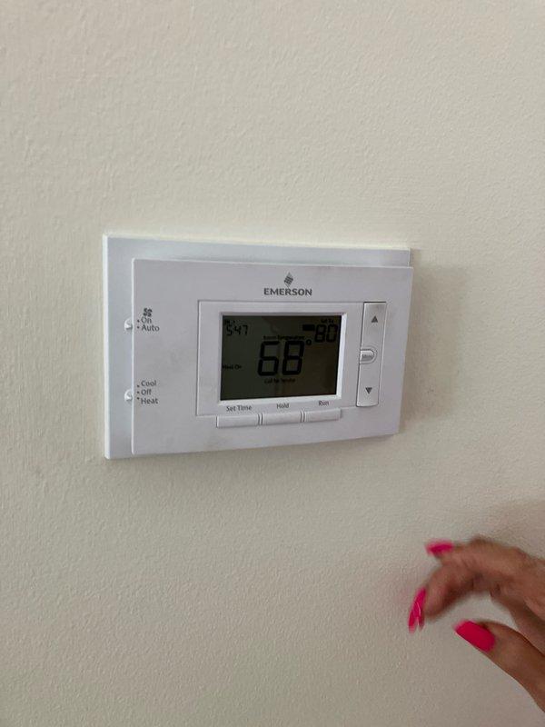 Completed estimate for replacement of existing furnace in residential condo utility room with new Lennox 100,000 BTU unit. Assessed current system, including Emerson digital thermostat and electrical disconnect panel, documented equipment conditions and specifications, and provided quote for complete furnace replacement installation.