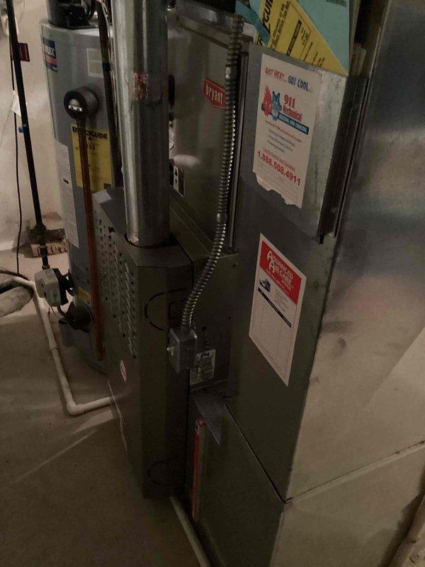 Responded to service call for 2005 furnace experiencing fan operation without heat production and chronic overheating issues due to oversized equipment. Performed diagnostic evaluation of basement-installed furnace system, assessed ductwork configuration and equipment sizing relative to heating load requirements. Documented existing system conditions including furnace cabinet, supply plenum measurements, and overall installation setup. Provided comprehensive replacement estimate addressing proper equipment sizing to eliminate overheating cycles and restore reliable heating operation to the residence.