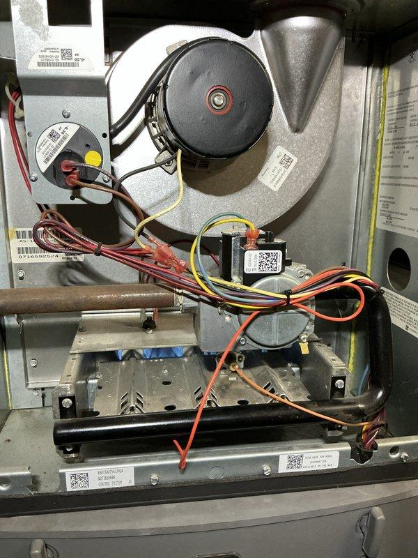Completed comprehensive tune-up and city certification inspection on 10-year-old residential furnace system located in basement. Performed full system diagnostics, inspected blower motor assembly, pressure switches, flame sensors, burner assembly, and heat exchanger components. Verified gas manifold pressure settings, tested all safety controls and electrical connections, confirmed proper operation of ignition system and burner flames. System operating within manufacturer specifications; all components functioning correctly with no deficiencies noted. Unit passed certification requirements and is approved for continued operation.