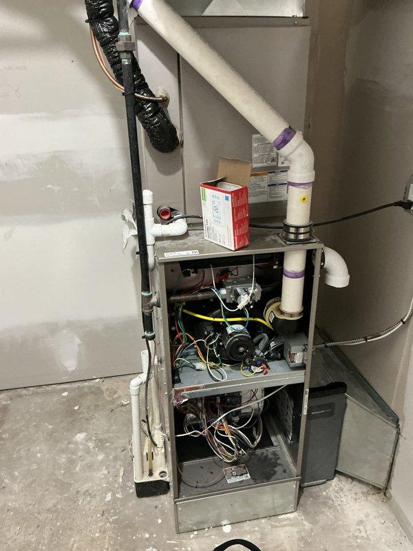 Responded to no-heat call with blank thermostat display at residential property. Upon arrival, found Bryant furnace system in basement with no power to unit or thermostat. Opened furnace cabinet and inspected internal components, wiring connections, and control board. Diagnosed power supply issue and restored electrical connection to system. Verified thermostat communication restored, tested furnace ignition sequence, and confirmed proper operation of blower motor and heating cycle. System returned to normal operation with thermostat displaying and furnace responding to heating calls.