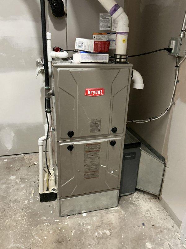 Responded to no-heat call with blank thermostat display at residential property. Upon arrival, found Bryant furnace system in basement with no power to unit or thermostat. Opened furnace cabinet and inspected internal components, wiring connections, and control board. Diagnosed power supply issue and restored electrical connection to system. Verified thermostat communication restored, tested furnace ignition sequence, and confirmed proper operation of blower motor and heating cycle. System returned to normal operation with thermostat displaying and furnace responding to heating calls.