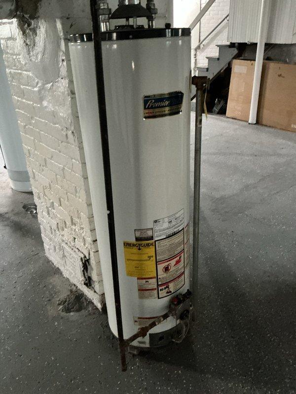 Performed routine maintenance flush on Premier brand tanked water heater located in basement of historic 1915 residence. Drained sediment from tank through drain valve, flushed system to remove mineral buildup and debris, and inspected all plumbing connections, supply lines, and shut-off valves for proper operation. Unit showed no signs of leakage or operational issues; all components functioning within normal parameters upon completion of preventive maintenance service.