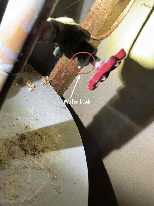 Responded to City of Rochester Hills mechanical violation notice addressing three critical issues with HVAC system. Repaired internal furnace leak with visible water accumulation on unit housing, installed required hammer arrestor on humidifier water line to code specifications, and replaced leaking humidifier shut-off valve with new component. All plumbing connections tested and verified leak-free, system returned to proper operation and brought into compliance with municipal mechanical code requirements.