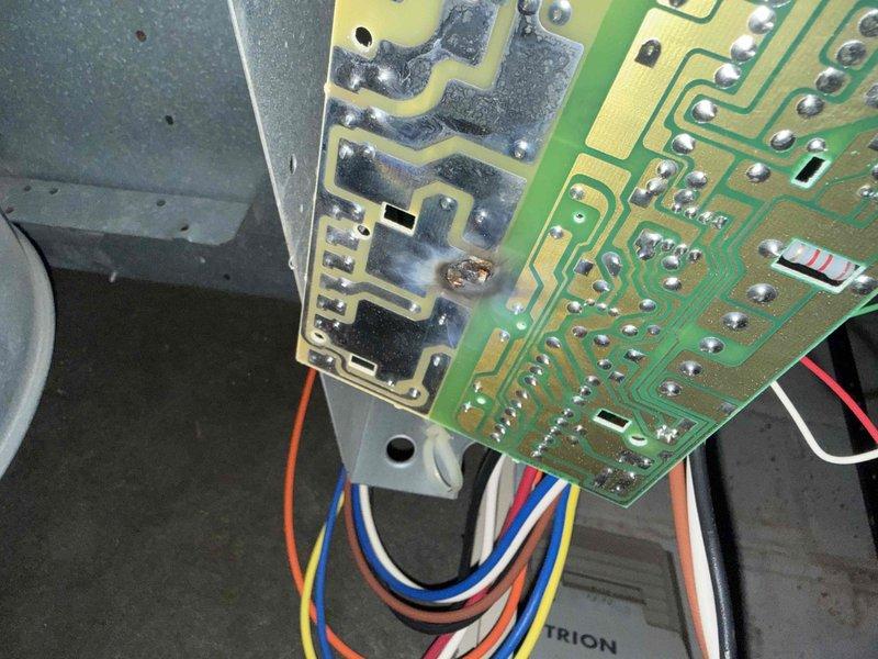 Responded to no heat call on basement furnace over 10 years old with inoperative blower fan. Upon inspection, diagnosed failed control board preventing blower motor operation. Identified visible heat damage and discoloration on primary circuit board, along with compromised electrical connections at terminal block. Removed and replaced defective control board assembly, reconnected all low-voltage wiring and line voltage connections to new board, and verified proper wire routing and secure terminations. Tested system operation through full heating cycle, confirmed blower motor engagement, verified proper airflow, and ensured all safety controls functioning correctly. Unit restored to normal heating operation with adequate temperature rise across heat exchanger.