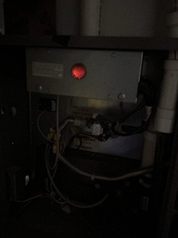Completed comprehensive tune-up on 10-year-old air conditioning system with outdoor condensing unit and basement furnace equipment. Performed standard maintenance protocol including inspection of electrical components, verified proper operation of control systems with illuminated indicator lights, and assessed outdoor unit fan assembly which showed moderate rust accumulation on center hub requiring monitoring for future service needs. Cleared debris from condensing unit base, confirmed all mechanical components functioning within normal parameters, and documented equipment condition with photographic records for maintenance history.