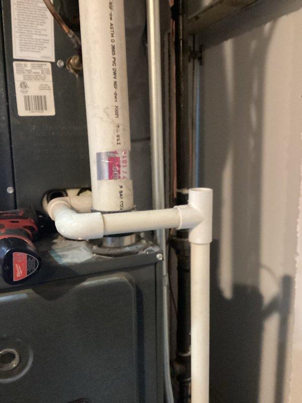 Completed comprehensive Gold AC inspection on 14-year-old residential air conditioning system with air handler located in basement. Performed multi-point inspection of both indoor and outdoor units, including examination of blower wheel assembly which showed moderate dust and debris accumulation on squirrel cage blades and housing. Inspected PVC condensate drain lines, electrical connections, control components, and overall system operation. System confirmed operational at time of inspection with all components functioning as designed.