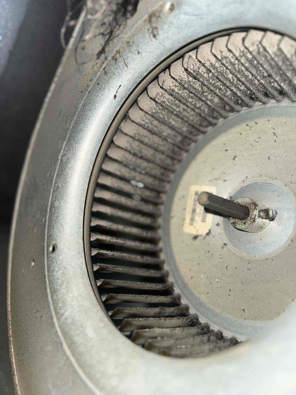 Completed comprehensive Gold AC inspection on 14-year-old residential air conditioning system with air handler located in basement. Performed multi-point inspection of both indoor and outdoor units, including examination of blower wheel assembly which showed moderate dust and debris accumulation on squirrel cage blades and housing. Inspected PVC condensate drain lines, electrical connections, control components, and overall system operation. System confirmed operational at time of inspection with all components functioning as designed.